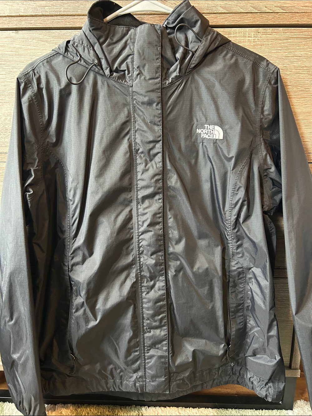 The North Face women’s black rain jacket